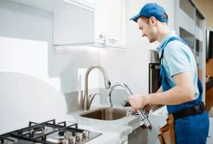 Plumber fixing pipe